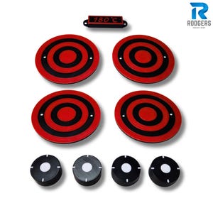 May include: A collection of red and black circular trivets with a bullseye pattern, plus smaller black and white circular items. A rectangular piece displays "180°C". The Rodgers Design & Print logo is in the upper right corner.