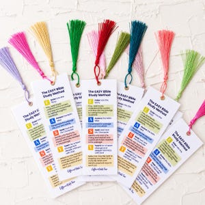 May include: A collection of white rectangular bookmarks, each featuring the text The EASY Bible Study Method and a colorful silk tassel. The bookmarks display a five-step guide with letters E, A, S, Y in yellow, blue, pink, and orange boxes.