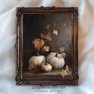 May include: A framed still life painting featuring three white pumpkins and autumn leaves against a dark background. The ornate frame is bronze-coloured. The text "InspireWithPrint Printable Wall Art" is at the bottom.