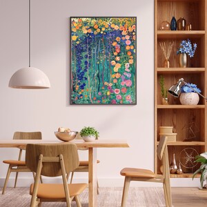 May include: A colorful abstract painting of a garden with flowers in shades of pink, yellow, orange, blue, and green. The painting is framed in black and hangs on a white wall.