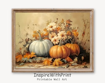 May include: A framed print featuring a still life of pumpkins, flowers, and autumn leaves. The pumpkins are white and orange, with white flowers and orange leaves. The print has a vintage aesthetic and the text "InspireWithPrint Printable Wall Art".