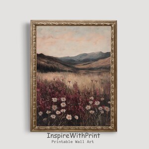 Pode incluir: Uma pintura emoldurada de uma paisagem com colinas onduladas e um campo de flores silvestres. O c&eacute;u &eacute; de um rosa suave e as colinas s&atilde;o de um verde opaco. As flores silvestres s&atilde;o brancas e rosas.