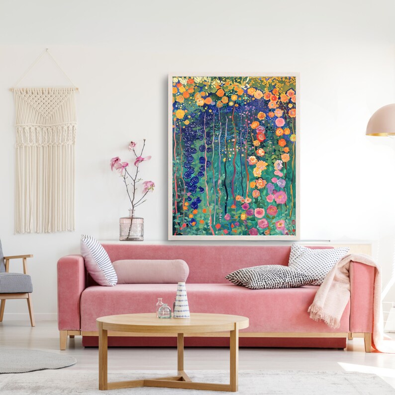 May include: A framed abstract painting of a garden with colorful flowers and green foliage. The painting is in a white frame and is hanging on a white wall.