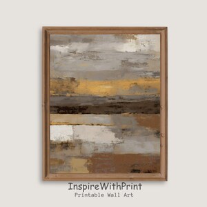 Puede incluir: Impresión artística abstracta en un marco de madera. La obra presenta bandas horizontales de color en tonos marrones, grises, dorados y blancos. El texto "InspireWithPrint Printable Wall Art" está impreso en la parte inferior del marco.
