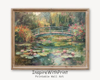 Puede incluir: Una pintura de un puente sobre un estanque con nenúfares. El puente es azul y el agua es verde. Hay nenúfares rosas en el estanque. La pintura está enmarcada en un marco de madera.