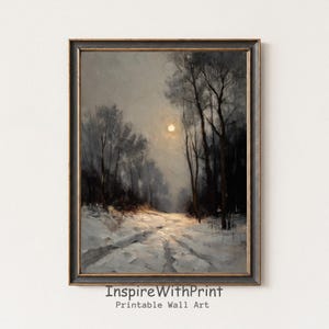 May include: A framed vintage winter landscape painting. The artwork depicts a snow-covered path leading into a forest, with a bright moon in the sky. The painting has a muted color palette of grays, whites, and browns. The frame is dark with gold accents.