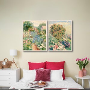 May include: Two framed paintings of a garden with flowers in shades of pink, white, and blue. The paintings are hung on a wall above a bed with red and white bedding.