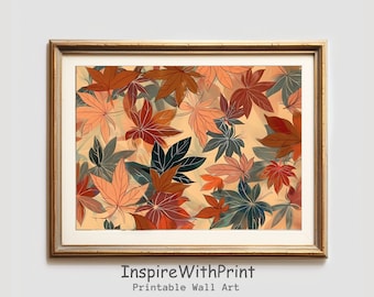 May include: A framed print featuring a repeating pattern of stylized autumn leaves in shades of orange, brown, and green. The leaves are set against a light beige background. The frame is gold. The text "InspireWithPrint Printable Wall Art" is at the bottom.