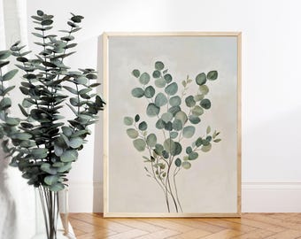 Puede incluir: Una pintura de acuarela enmarcada de una rama de eucalipto con hojas verdes sobre un fondo beige claro.
