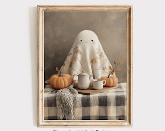 May include: A framed print featuring a whimsical ghost character draped in a floral patterned sheet. The scene includes pumpkins, a teapot, and a teacup on a checkered tablecloth. The text "InspireWithPrint Printable Wall Art" is at the bottom.