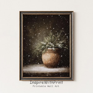May include: A framed print featuring a rustic, brown pot filled with evergreen branches dusted with snow. The artwork has a vintage aesthetic, with a dark background and falling snowflakes. The text "InspireWithPrint Printable Wall Art" is at the bottom.