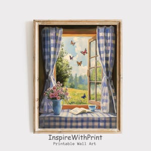 Puede incluir: Pintura enmarcada de una escena de ventana con cortinas a cuadros azules y blancos. Un jarrón azul contiene flores rosas. Un libro y una taza de té están en el alféizar. Mariposas revolotean afuera, sobre un campo verde y árboles. El texto "InspireWithPrint Printable Wall Art" está en la parte inferior.