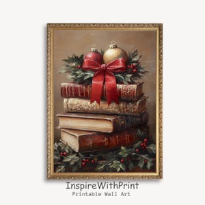 May include: A framed print featuring a stack of books adorned with Christmas ornaments and a red bow. The books have aged, textured covers. A red and gold ornament sits atop the books, with holly and red berries. The text "InspireWithPrint" is at the bottom.