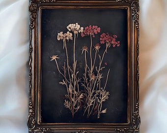 May include: A framed print of pressed flowers in shades of pink, white, and brown against a dark background. The frame is ornate and has a gold finish. The text "Inspire With Print" and "Printable Wall Art" is visible at the bottom of the image.
