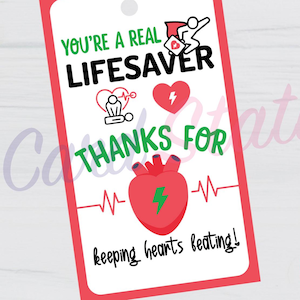 May include: A red and white gift tag with the text "YOU'RE A REAL LIFESAVER" and "THANKS FOR keeping hearts beating!" includes a heart and medical symbols. The tag is 2 inches by 3.5 inches.