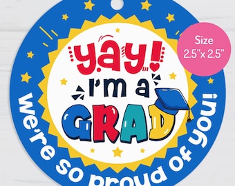 May include: A round blue graduation-themed sticker with the text "yay! I'm a GRAD" in colorful letters. The sticker is 2.5" x 2.5" and includes the phrase "we're so proud of you!" and a graduation cap graphic.
