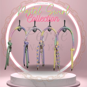 May include: The image showcases four colorful dog leashes from the "Pastel Swirl Collection." Each leash features a unique pastel color scheme, including pink, purple, yellow, and green. The leashes are displayed against a pink background with the collection's name in a cursive font.