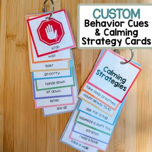 May include: Custom behavior cue and calming strategy cards. The cards are attached to a metal ring. The cards have colorful borders and include phrases like "stop", "wait", "quiet", and "take deep breathes".
