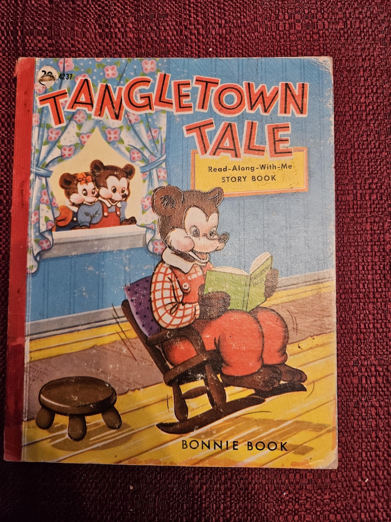 May include: A vintage children's book titled "Tangletown Tale" with a red cover and a cartoon bear reading a book in a rocking chair. The book is a "Read-Along-With-Me Story Book" published by Bonnie Book.