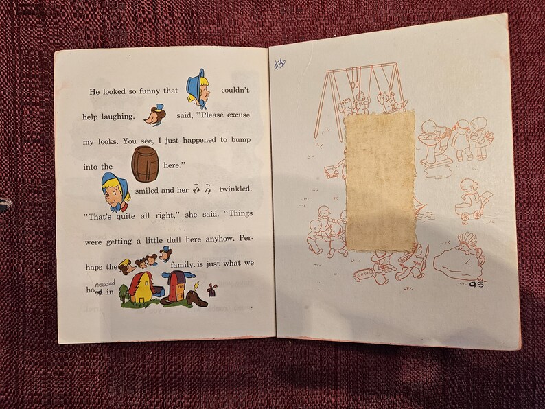May include: An open book with illustrations of children playing on a swing set and a girl with a barrel. The text on the page reads "He looked so funny that couldn't help laughing. said, "Please excuse my looks. You see, I just happened to bump into the here." smiled and her twinkled. "That's quite all right," she said. "Things were getting a little dull here anyhow. Per haps the family is just what we needed here in"
