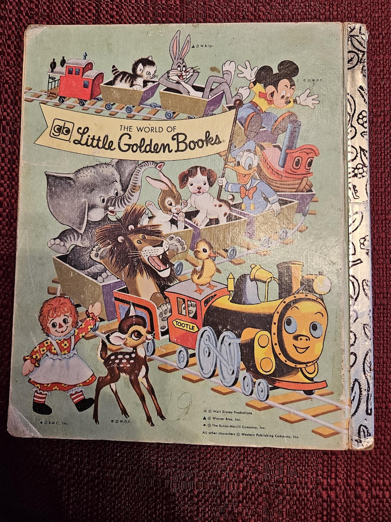 May include: A vintage Little Golden Book cover featuring a colorful train with various cartoon characters, including Mickey Mouse, Donald Duck, and a deer. The book's title is "The World of Little Golden Books."