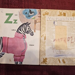 May include: A vintage children's book with a zebra wearing a pink jacket on the cover. The book is titled "Little Golden Books" and has a list of other books on the back cover.