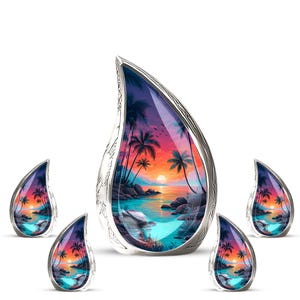 May include: Five teardrop-shaped pendants with a tropical sunset scene inside a silver-colored frame. The scene features palm trees, a colorful sky, and ocean waves. The pendants are displayed on a white background.