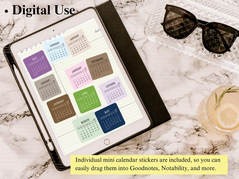 May include: A tablet displaying a digital planner page with multiple colorful square calendar stickers in shades of blue, purple, brown, pink, and green. The screen shows the text Digital Use and a note about dragging stickers into apps.
