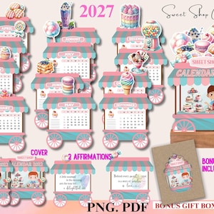 Puede incluir: Un conjunto de calendario Sweet Shop 2027 con doce páginas mensuales diseñadas como carritos de dulces en color turquesa y rosa. Cada página muestra un mes, una cuadrícula de calendario e ilustraciones de postres, una portada, tarjetas de afirmación y caja.