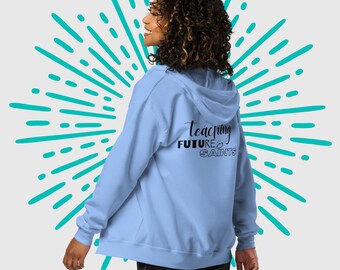 Teaching Future Saints Women's Zip Hoodie , Catholic Teacher's Gift , Catholic Homeschool Mom Hoodie, Funny Catholic School Zip Hoodie