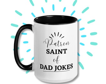 May include: White coffee mug with a black rim and handle. The mug has black text that reads "Patron Saint of Dad Jokes".