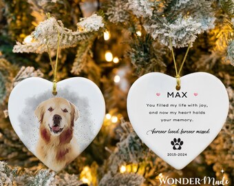 May include: White ceramic heart-shaped ornament with a watercolour image of a golden retriever dog. The ornament has the text "MAX" in pink hearts, "You filled my life with joy, and now my heart holds your memory. Forever loved, forever missed." and "2015-2024" with a paw print.
