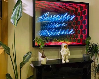 May include: A rectangular infinity mirror wall art piece featuring a black frame and a bright blue neon script that reads Everyday is a Weekend, set against a repeating red geometric tunnel pattern that creates a deep, immersive visual effect.
