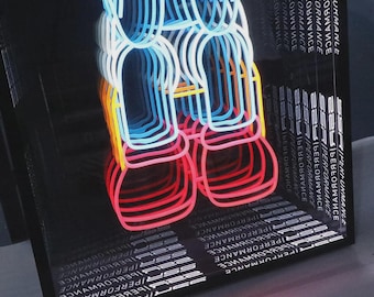 May include: A square infinity mirror box featuring a neon light display with repeating blue, orange, and red circular outlines. The black frame is printed with the repeated white text SSR PERFORMANCE, creating a deep visual tunnel effect.