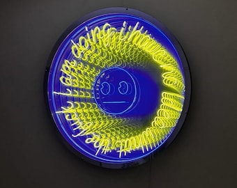 May include: A circular infinity mirror wall art piece featuring bright yellow neon-style lettering that reads "what the fuck am i doing i have no idea" surrounding a central blue neon smiley face icon with a flat line mouth and circular eyes.