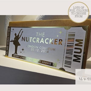 May include: Gold foil ticket for The Nutcracker at the London Coliseum on 20 December 2024. The ticket says "You are going to see" and "Mum".