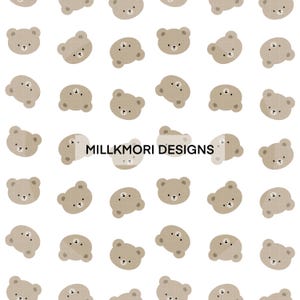 May include: A repeating pattern of tan teddy bear illustrations on a white background. Each bear has a simple face with small black eyes and a stitched-like nose. The text "MILLKMORI DESIGNS" is in the center of the image.