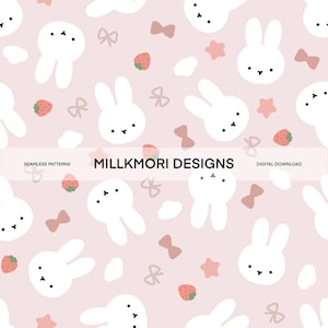 May include: A seamless pattern with white bunny faces, strawberries, bows, and stars on a pale pink backdrop. The text "MILLKMORI DESIGNS" is in the centre, with "SEAMLESS PATTERNS" and "DIGITAL DOWNLOAD" on either side.