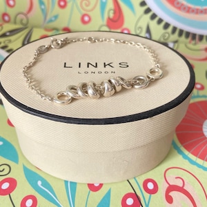 Authentic Sterling Silver Links of London Bracelet with Sweetie beads.