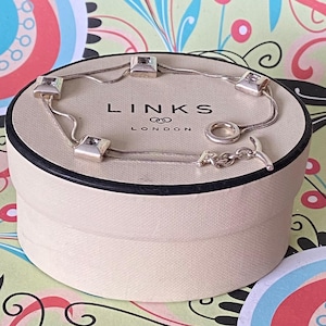 Authentic Sterling Silver Links of London four square bracelet ideal for that extra sparkle.