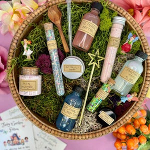 May include: A wooden bowl filled with various fairy garden supplies, including flower nectar, butterfly wings, petal powder, fairy dust, fountain of youth elixir, dream sleep tonic, enchanted garden essence, moon crystals, and a wooden spoon.