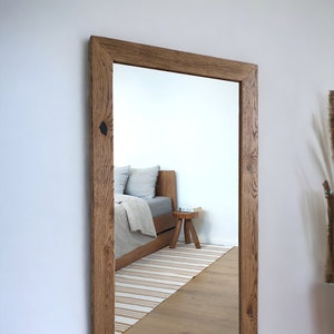 Oak frame bathroom mirror. Wall oak wood mirror. Mirror in handcrafted wooden frame in rustic style. Solid oak wood framed mirror.