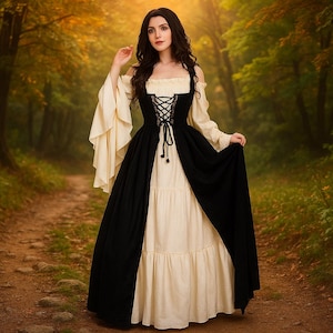 May include: A long, layered dress with a black overskirt and cream-colored bodice and skirt. The bodice features a laced-up front, and the sleeves are long and flowing. The dress is suitable for Renaissance or medieval-themed events.