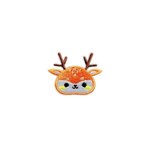 May include: An embroidered iron-on patch featuring a cartoon deer with brown antlers and a light orange body. The deer has a white face with black eyes and a small, pink nose.