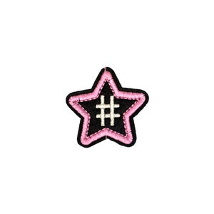 May include: A black star-shaped patch with a pink outline and a white hashtag symbol in the center.