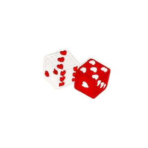 May include: Two dice with red hearts on white and red backgrounds. The dice are lying on their sides.