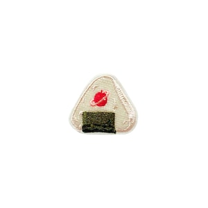 May include: White embroidered patch of a Japanese onigiri rice ball with a red umeboshi plum filling and a green seaweed wrap.