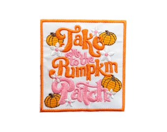 May include: Embroidered iron-on patch with an orange and pink design. The patch says "Take me to the Pumpkin Patch" with pumpkins and flowers.