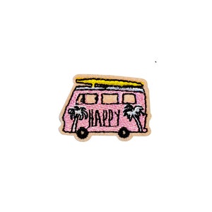 May include: Pink embroidered patch of a vintage van with a surfboard on top. The van has the word "HAPPY" written on the side and palm trees on either side of the word.