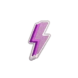 May include: Purple lightning bolt shaped iron-on patch with white stitching.
